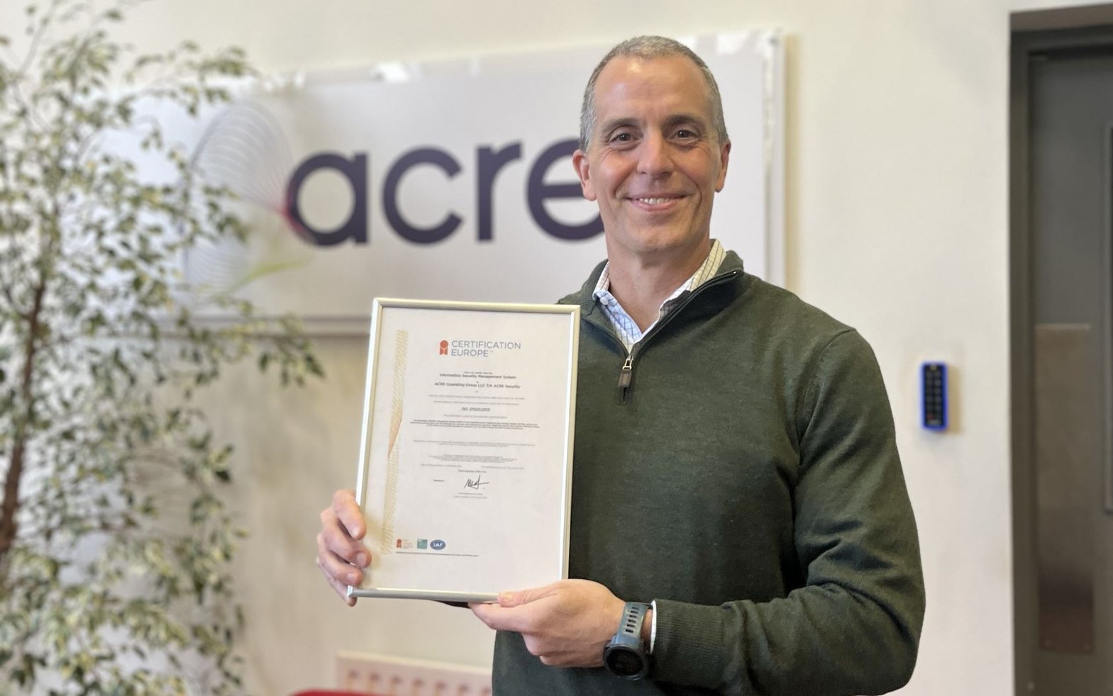 Don Joos, acre CEO, holding acre's ISO 27001 certification